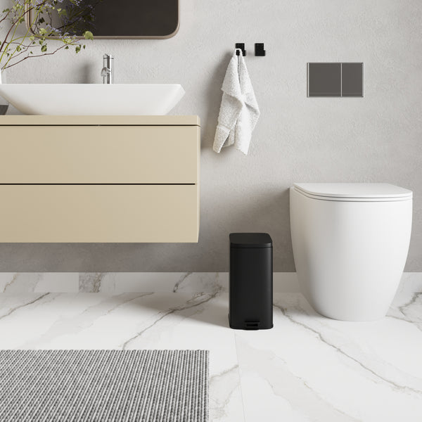 prullenbak naast toilet